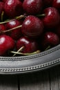 Cherries covered by water drops in tin plate Royalty Free Stock Photo