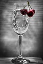 Cherries on a crystal glass with a high stem. Summer still life