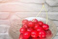 Cherries with cuttings in an iron plate Royalty Free Stock Photo