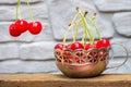 Cherries with cuttings in an iron vintage mug Royalty Free Stock Photo