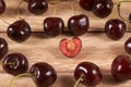 Cherries are diffuse on a wooden background