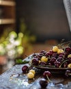 Cherries in drops of water on a plate on a wet wooden table. Summer. Royalty Free Stock Photo