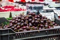 Cherries on the farm market in the city. Fruits and vegetables at a farmers market Royalty Free Stock Photo