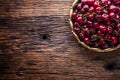 Cherries. Fresh sweet cherries. Delicious cherries with water drops in retro bowl on old oak table Royalty Free Stock Photo