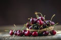 Cherries. Fresh sweet cherries. Delicious cherries with water drops in retro bowl on old oak table Royalty Free Stock Photo