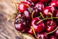 Cherries. Fresh sweet cherries. Delicious cherries with water drops in retro bowl on old oak table Royalty Free Stock Photo