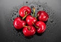 Cherries on gray background. Fresh ripe Cherry berries close-up. Organic red cherries with water drops Royalty Free Stock Photo