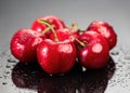 Cherries on gray background. Fresh ripe Cherry berries close-up. Organic red cherries with water drops Royalty Free Stock Photo