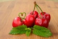 Cherries and green heart Royalty Free Stock Photo