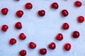 Cherries heart shaped, on a wooden background, copy space Royalty Free Stock Photo