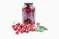Cherries beside jar of cherry compote Royalty Free Stock Photo