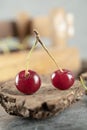 Cherries on a piece of wood