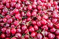 Cherries pile at farmers market, background, texture Royalty Free Stock Photo