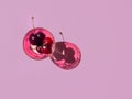 Cherries in pink bocal on lilac background Royalty Free Stock Photo