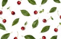 Cherries. Red ripe cherry berries and leaves on white background. Flat lay, top view Royalty Free Stock Photo