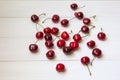 Cherries spilled at white wooden background Royalty Free Stock Photo