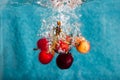 Cherries splashing in water