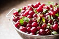 Cherries in a steel sieve. top view, texture Royalty Free Stock Photo