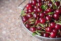 Cherries in a steel sieve. top view, texture Royalty Free Stock Photo