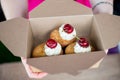 Cherry and Almond bakewell buns held in cardboard box