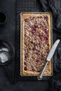 Cherry and almond streusel tart, black background Royalty Free Stock Photo