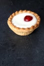 Cherry bakewell tart on dark background Royalty Free Stock Photo