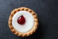 Cherry bakewell tart on dark background Royalty Free Stock Photo