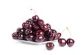 Cherry berries in water drops on white plate white background isolated close up macro Royalty Free Stock Photo