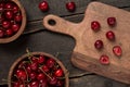 Fresh cherries on a wooden board close up background on a wooden table Royalty Free Stock Photo