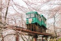 Cherry Blossom Festival at Funaoka Castle Ruin Park,Shibata,Miyagi,Tohoku,Japan on April12,2017:Slope car passing sakura tunnel Royalty Free Stock Photo