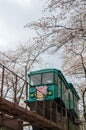 Cherry Blossom Festival at Funaoka Castle Ruin Park,Shibata,Miyagi,Tohoku,Japan on April12,2017:Slope car passing sakura tunnel Royalty Free Stock Photo