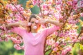 Cherry Blossom Festival. Young pretty woman enjoy spring nature. Royalty Free Stock Photo