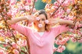 Cherry Blossom Festival. Young pretty woman enjoy spring nature. Royalty Free Stock Photo
