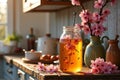 Cherry blossom tea in sunlit kitchen with spring decor Royalty Free Stock Photo