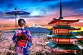 Cherry blossoms in spring, Asian woman wearing japanese traditional kimono at Chureito pagoda and Fuji mountain at sunset in Japan