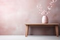 Cherry blossoms in vase on table against soft pink haze background Royalty Free Stock Photo