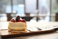 Cherry cheese cake on wooden plate Royalty Free Stock Photo