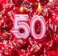 Cherry cheese cake with candles for 50th birthday Royalty Free Stock Photo