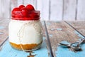 Cherry cheesecake in a mason jar on rustic wood Royalty Free Stock Photo