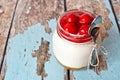 Cherry cheesecake in a mason jar with spoon Royalty Free Stock Photo