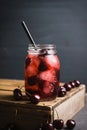 Cherry cocktail with ice in glass jar Royalty Free Stock Photo