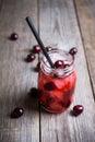 Cherry cocktail with ice in glass jar Royalty Free Stock Photo