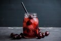 Cherry cocktail with ice in glass jar Royalty Free Stock Photo