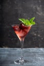 Cherry cocktail in martini glass with berries and mint leaves Royalty Free Stock Photo