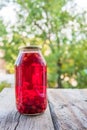 Cherry compote in the big glass jar. Homemade preserved cherries Royalty Free Stock Photo