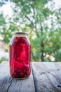 Cherry compote in the big glass jar. Homemade preserved cherries Royalty Free Stock Photo