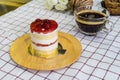 Cherry Cream Cake on wooden plate and coffee cup Royalty Free Stock Photo