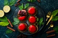 Cherry cream-mousse dessert with cherries and mint on a black stone plate. Top view. Rustic style Royalty Free Stock Photo