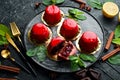 Cherry cream-mousse dessert with cherries and mint on a black stone plate. Top view. Rustic style Royalty Free Stock Photo