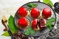 Cherry cream-mousse dessert with cherries and mint on a black stone plate. Top view. Rustic style Royalty Free Stock Photo